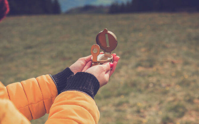 A compass held by a student.