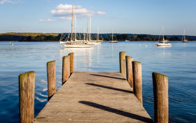 a pier with serene water, a tourist place