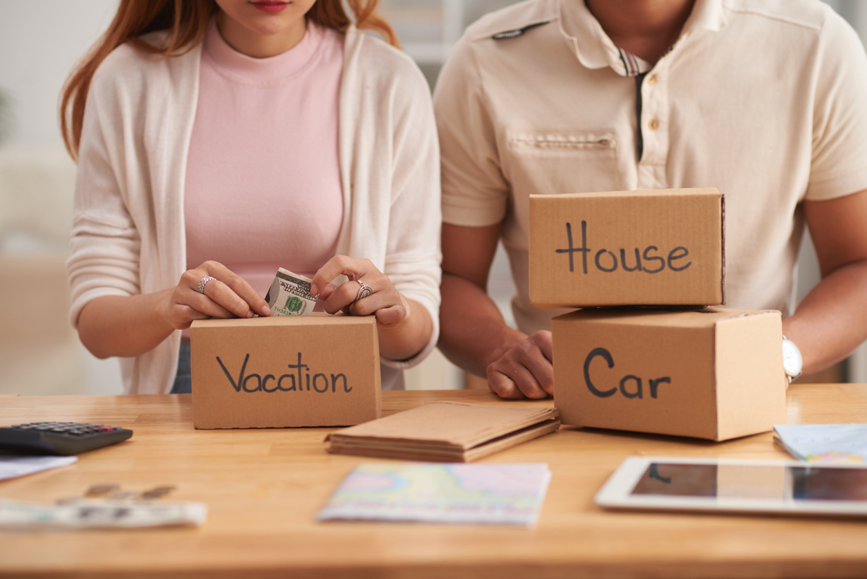 Couple saving cash in the vacation box, mortgage cash-out refinance vs. personal loans.