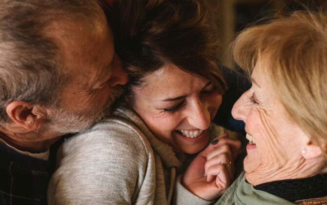 An elderly couple with their daughter.