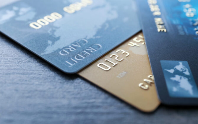 three credit card lying on the table, consolidating debt with a personal loan