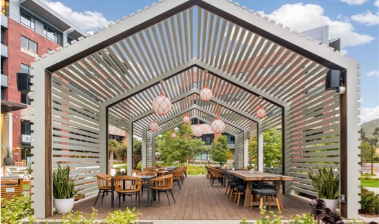 Outdoor patio with tables and chairs.