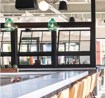 Photograph of a lunch counter with seating nearby