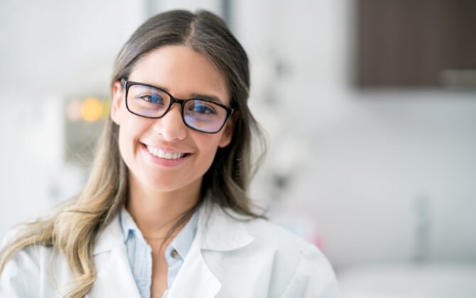 Portrait of a happy dentist looking at the camera smiling