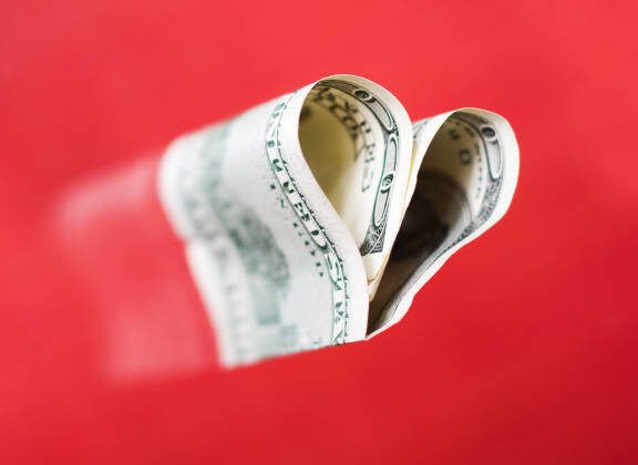 100 dollar bill in the shape of a heart