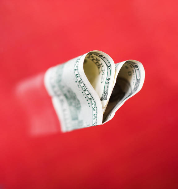 100 dollar bill in the shape of a heart