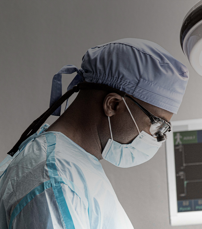 doctor wearing scrub and mask, and perform an operation. Laurel Road loan for doctors
