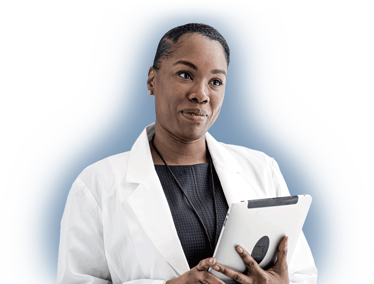 a female doctor wearing a white coat and holding a silver iPad