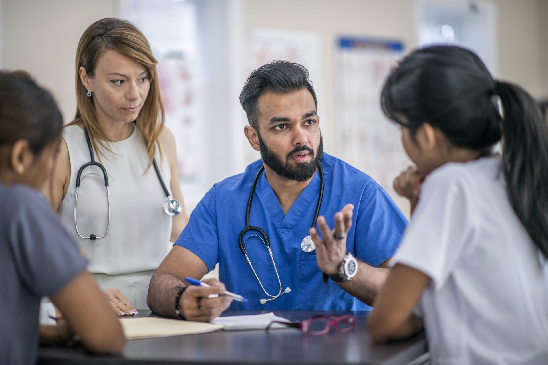 Doctors and residents in a meeting discussions.