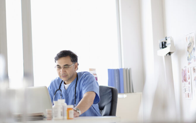 Doctor working on laptop