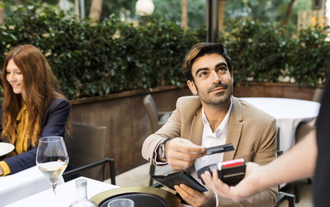 Man paying with credit card in a restaurant