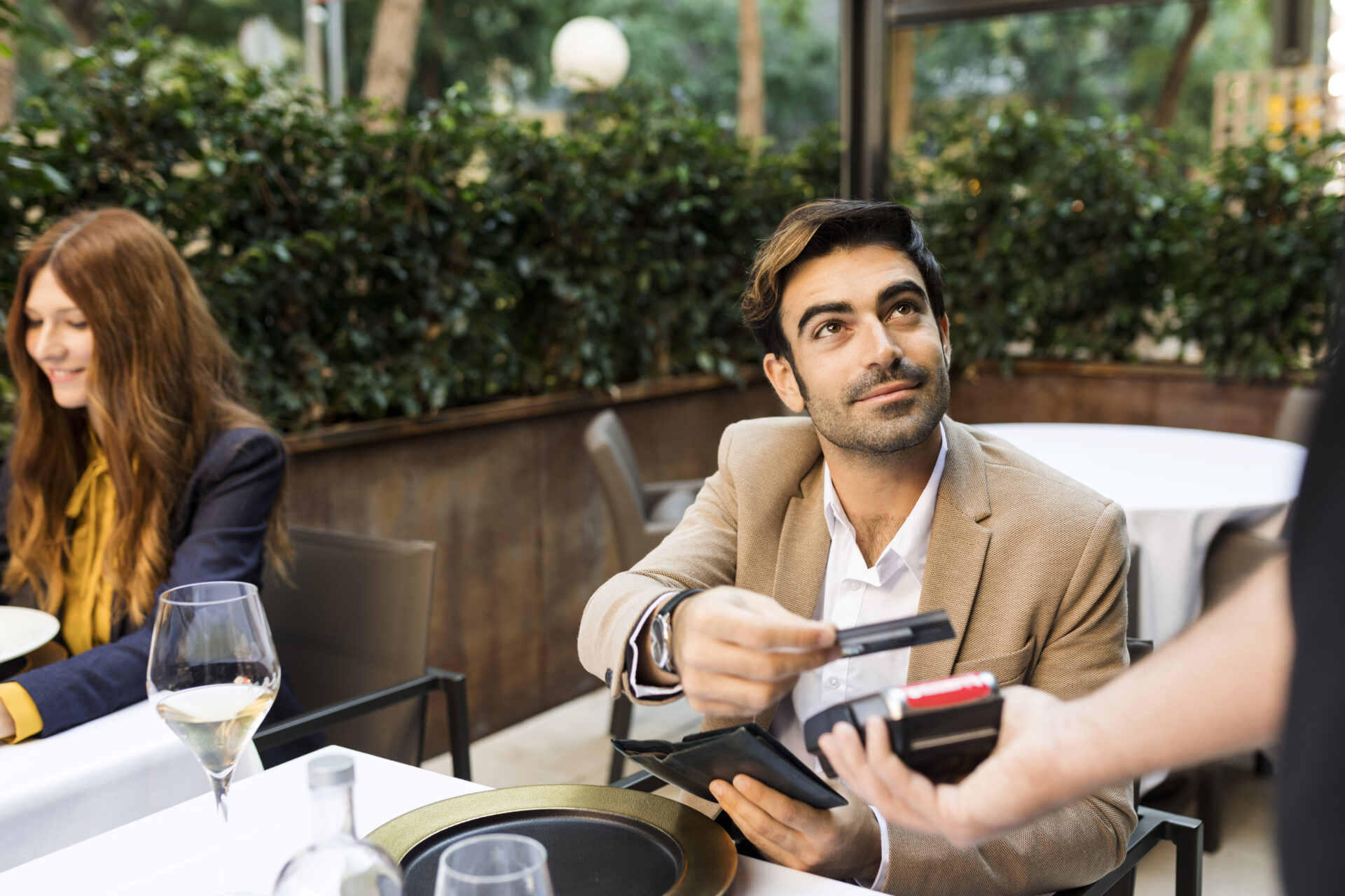 Man paying with credit card in a restaurant