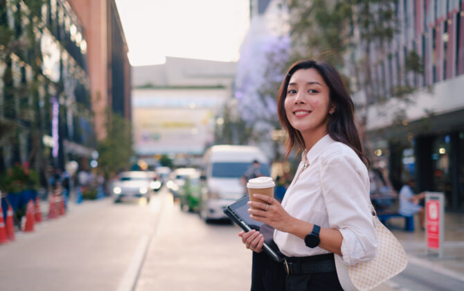 Woman enjoying coffee after getting her student loans debt forgiven