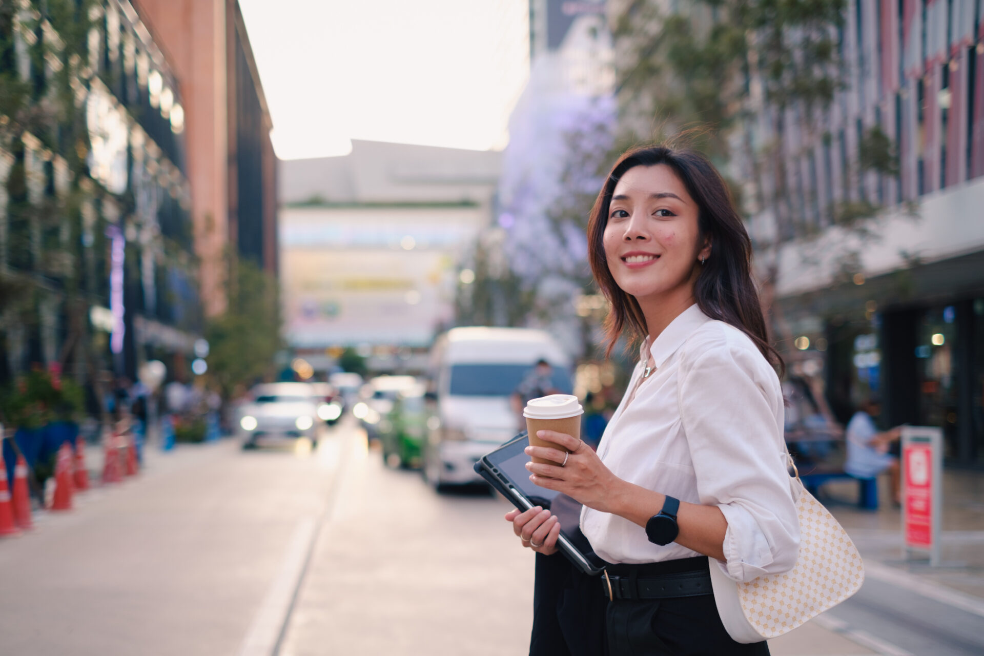 Woman enjoying coffee after getting her student loans debt forgiven