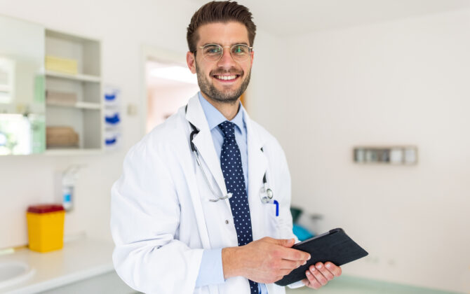 smiling doctor looking for student loan forgiveness