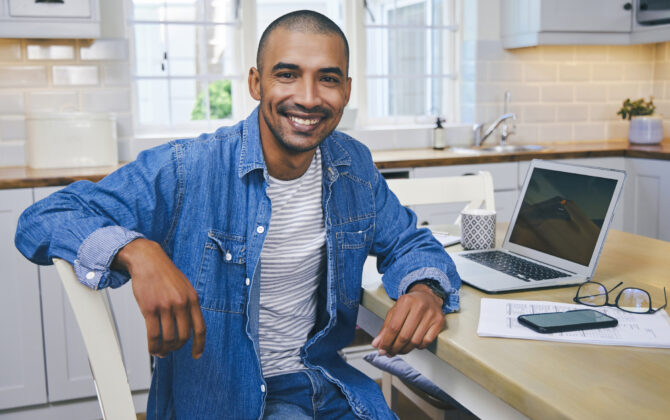 A man is happy after successfully switching to one bank for all of his checking and savings needs.