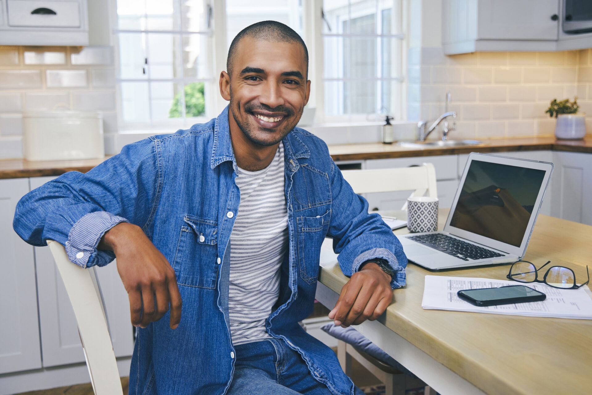 A man is happy after successfully switching to one bank for all of his checking and savings needs.