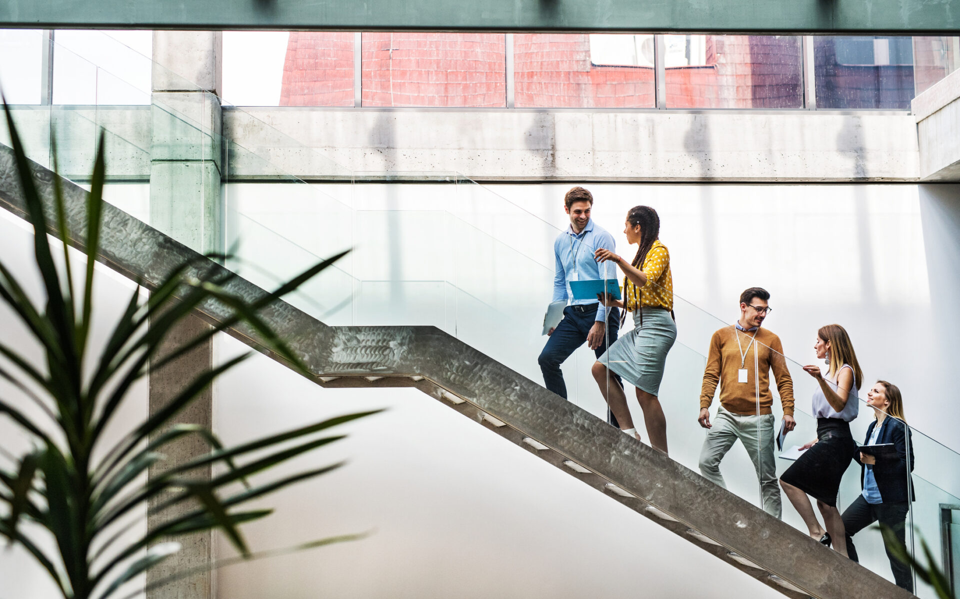 businesspeople walking up stairs learning about PAYE