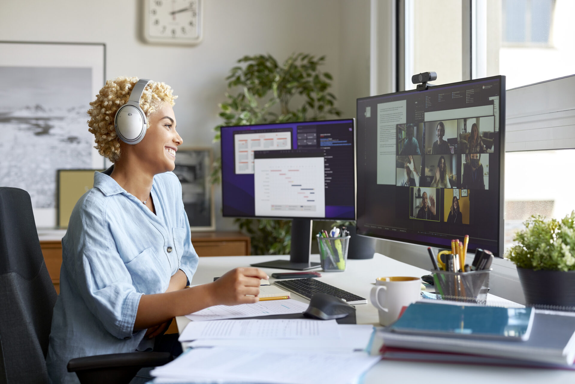 Happy Businesswoman on Video Call With Colleagues