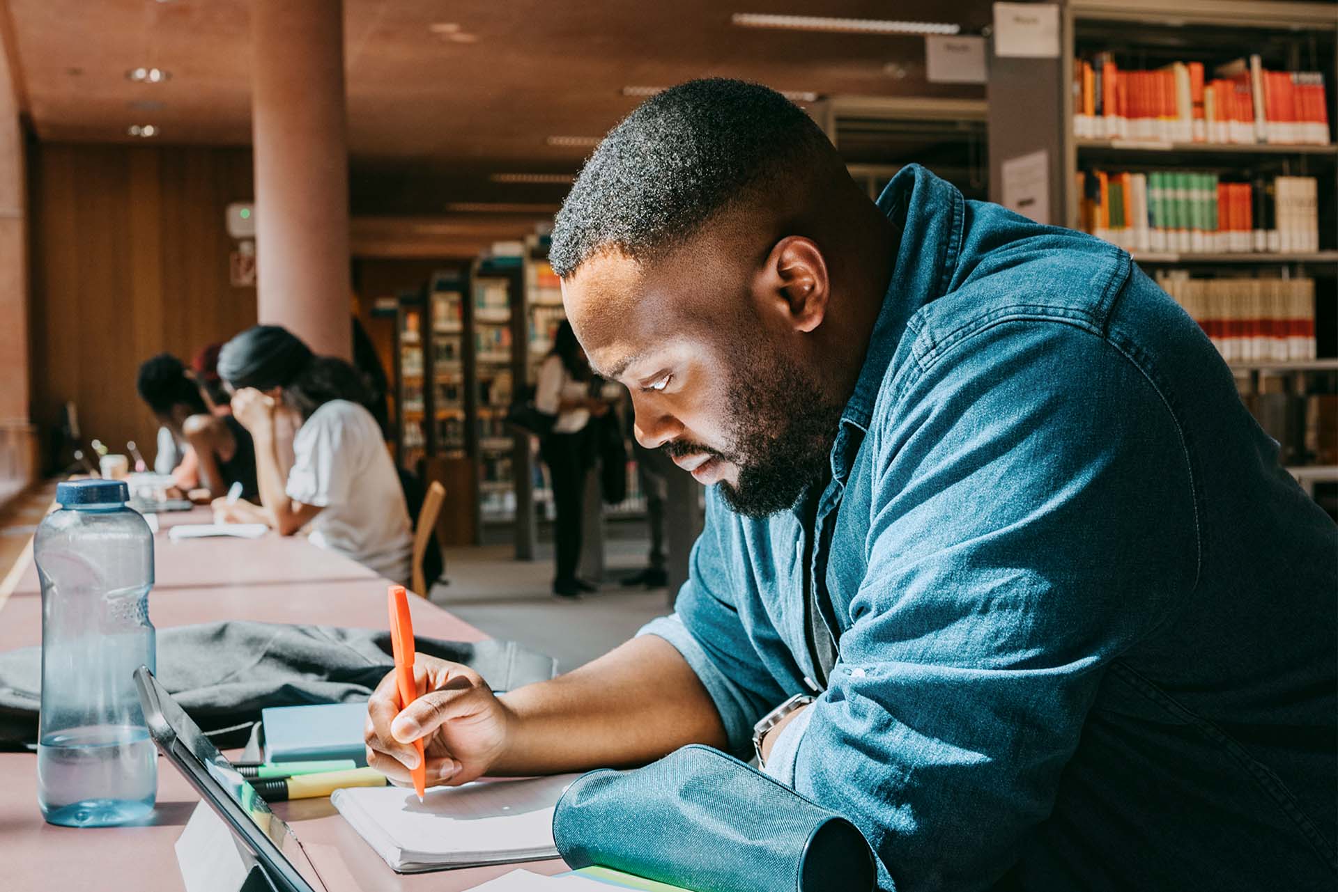 Young doctor learning about federal student loan repayment and forgiveness under SAVE plan