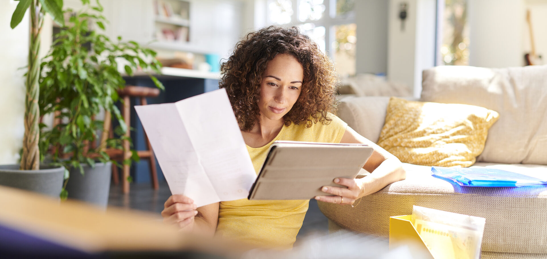 A woman is reading a guide to personal loans before deciding to take out a loan.