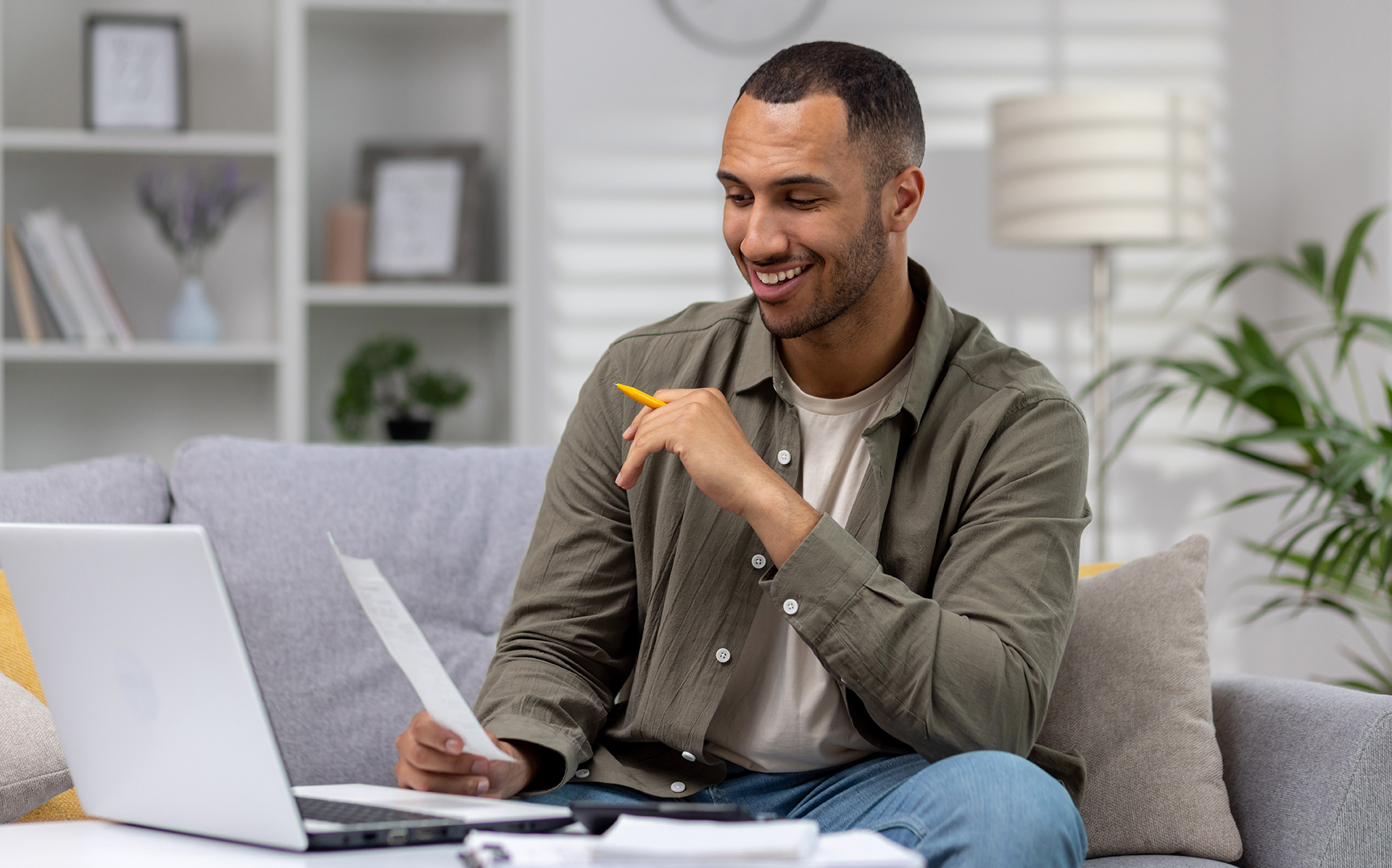 Young successful hispanic man reviewing student loan repayment options