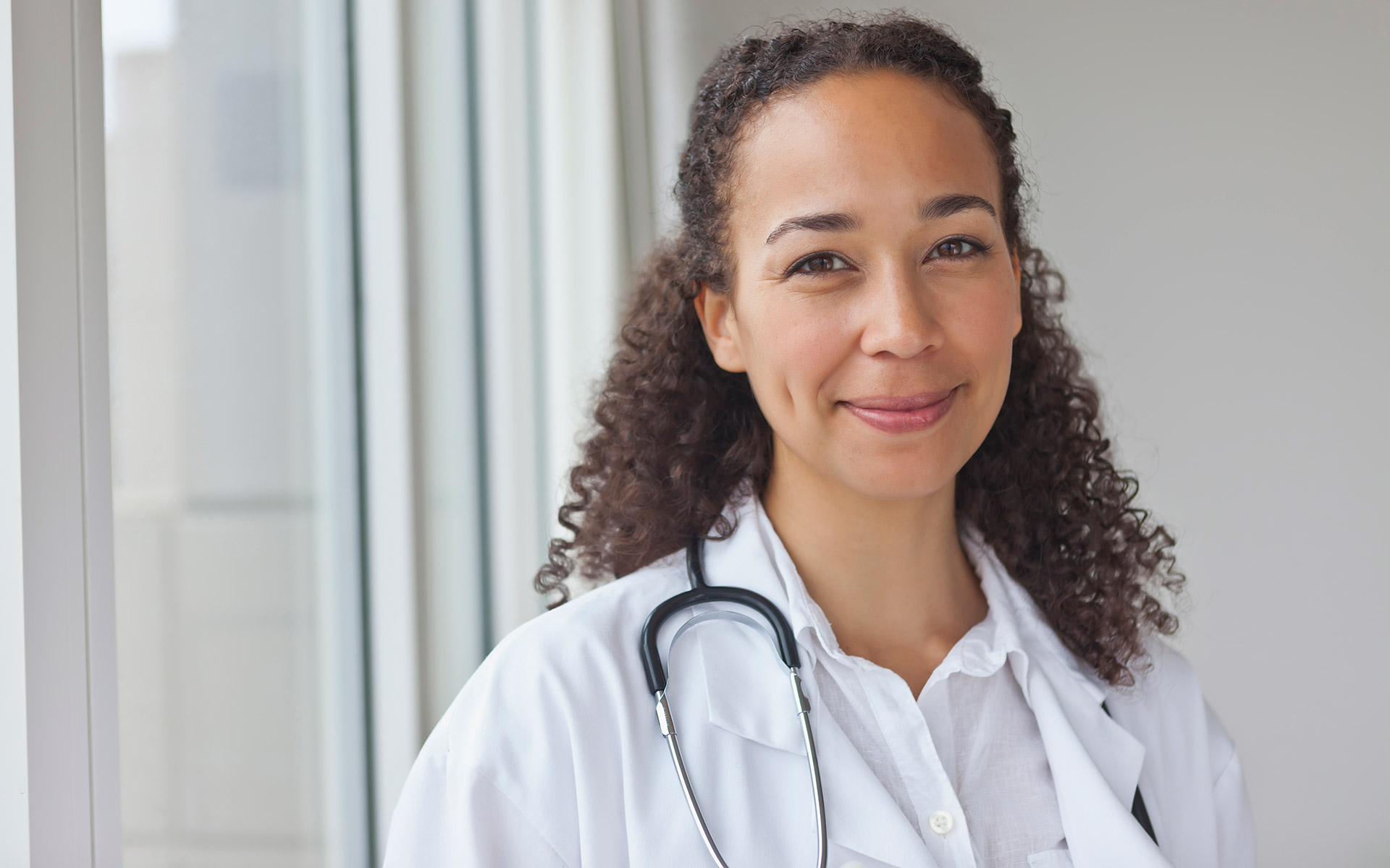 Smiling doctor understands how PSLF can hel her serve communities in need
