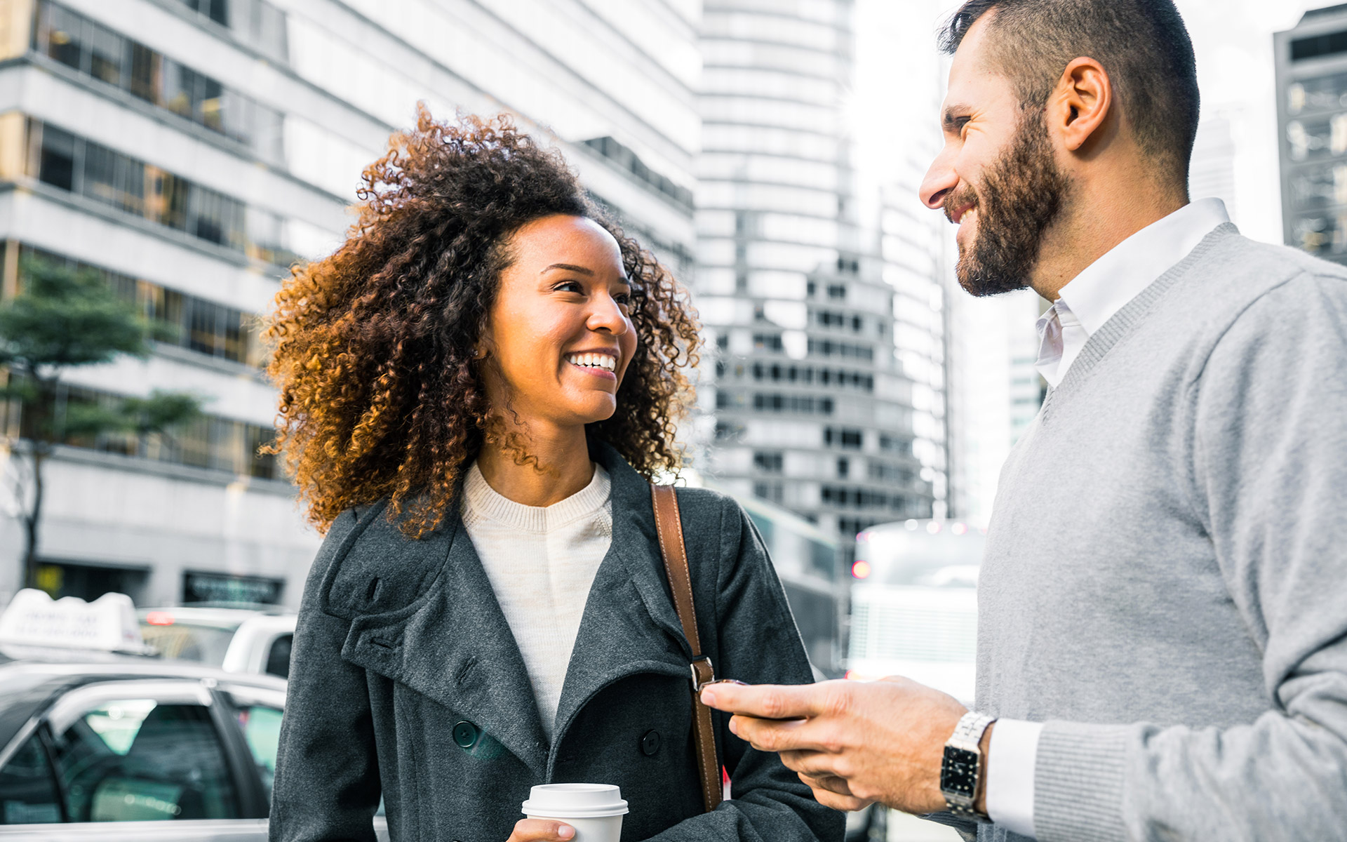 A woman and man smiling, embodying debt relief through career forgiveness options.